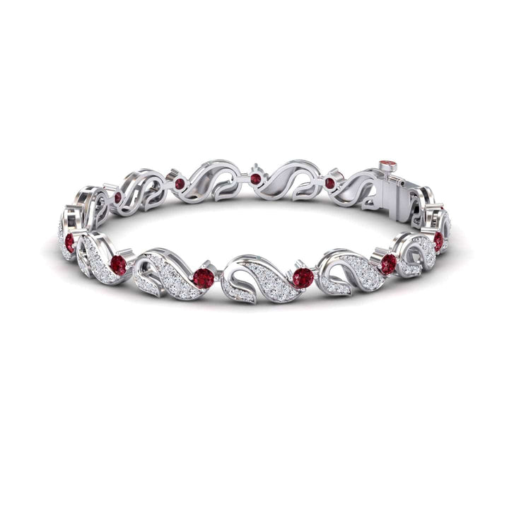 The Ruby & Diamond Swirl Link Bracelet - Elizabeth features an intricate leaf pattern with sparkling white stones and round red gemstones, beautifully displayed against a white background.