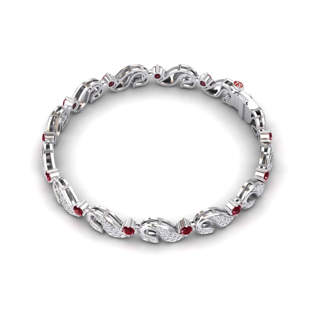 The Ruby & Diamond Swirl Link Bracelet - Elizabeth features an intricate silver design with alternating sparkling white diamonds and red rubies in an elegant, looped pattern.