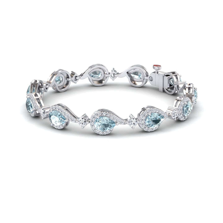 The Aquamarine & Diamond Tennis Bracelet - Gemma features alternating pear-shaped and round light blue aquamarines, each encircled by sparkling diamonds, all set in silver with a secure clasp.