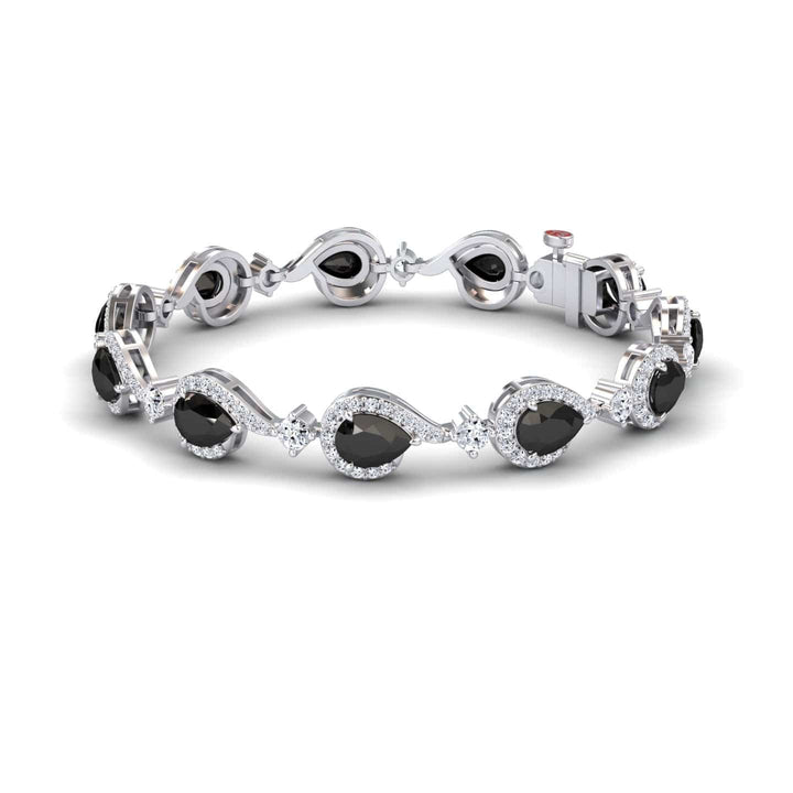 The Black & White Diamond Tennis Bracelet - Gemma features oval black gemstones framed by clear stones in a wavy, elegant pattern, with a secure clasp and sophisticated polished design.