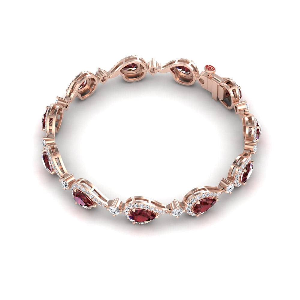 The Ruby & Diamond Tennis Bracelet - Gemma showcases oval red gemstones and small clear stones in an intricate rose gold design on a white background.