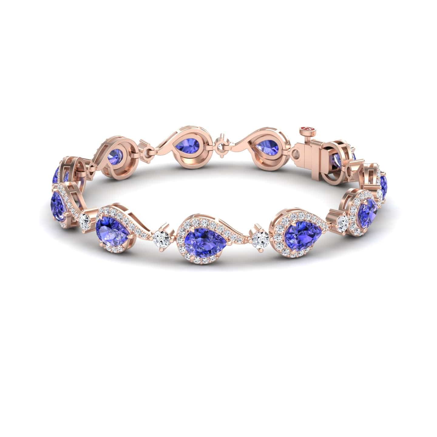The Tanzanite & Diamond Tennis Bracelet - Gemma features oval blue gemstones, each encircled by sparkling diamonds, set in rose gold and linked in an elegant, repeating pattern with a secure clasp.