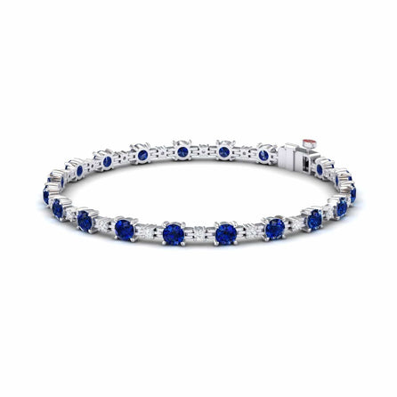 The Lab Grown Blue Sapphire & Diamond Halo Tennis Bracelet - Isabella features round blue sapphires and diamonds set in silver, with gemstones evenly spaced around the band, shown on a white background.