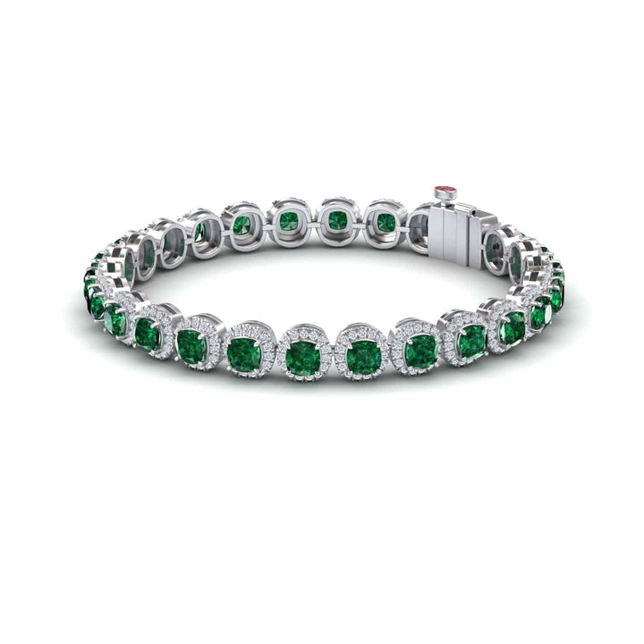 The Lab Grown Emerald & Diamond Halo Tennis Bracelet - Isabella features alternating round green lab-grown emeralds and clear diamonds, arranged in a circle with a visible clasp on one side.