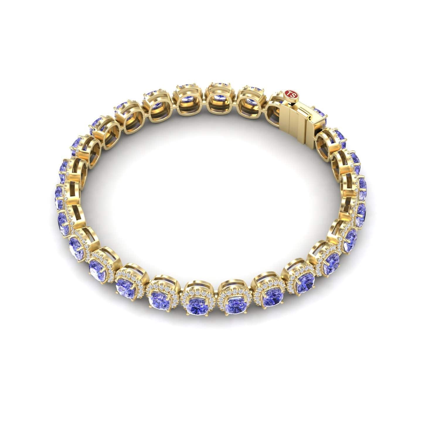 The Tanzanite & Diamond Halo Tennis Bracelet - Isabella showcases a row of round blue gemstones in prong settings with a secure clasp, elegantly displayed on a white background.