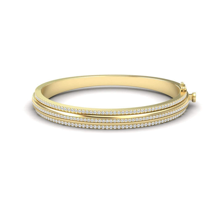 The Bold White Diamond Bangle: Unconventional Elegance - Amalia features multiple rows of sparkling diamonds along the top and a side clasp, combining luxurious gold with a striking, elegant design.