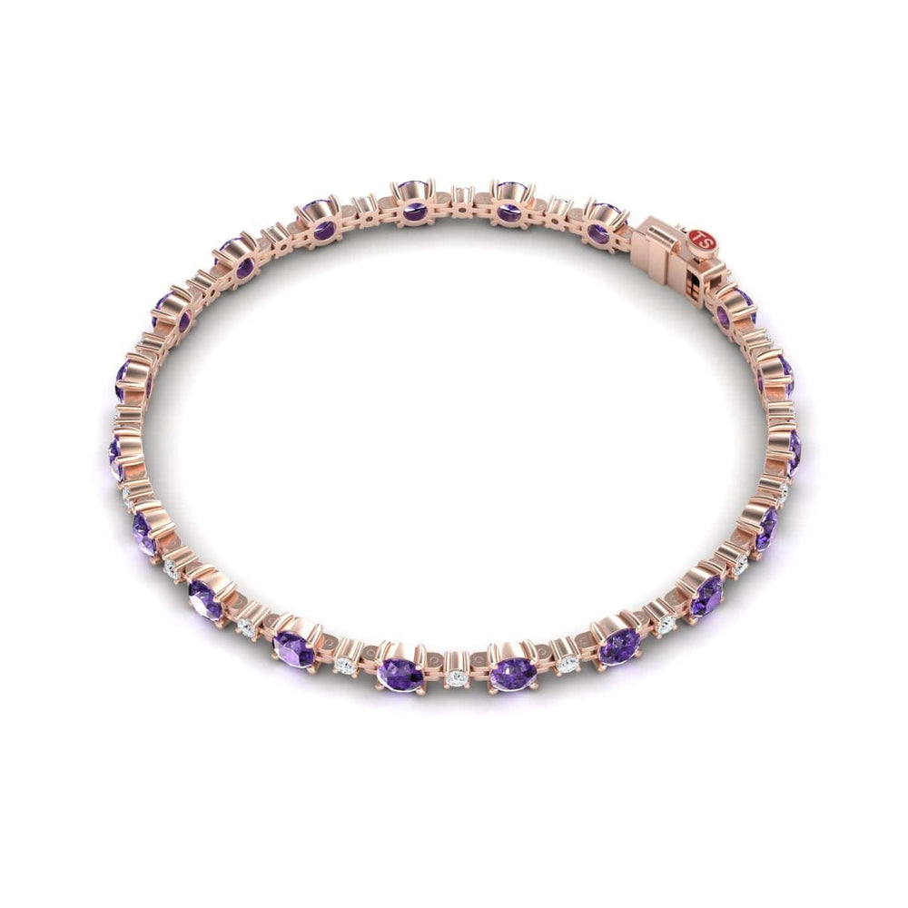 The Amethyst & Diamond Tennis Bracelet - Natalia showcases oval purple gemstones and sparkling white accents in a repeating rose gold setting, displayed against a white background.