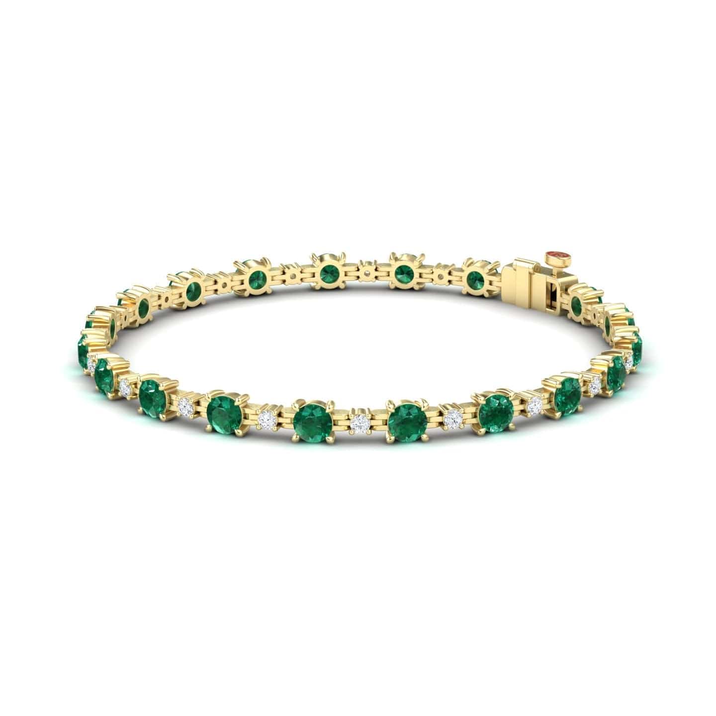 The Emerald & Diamond Tennis Bracelet - Natalia features a row of round green gemstones in prong settings and secures with a box clasp.