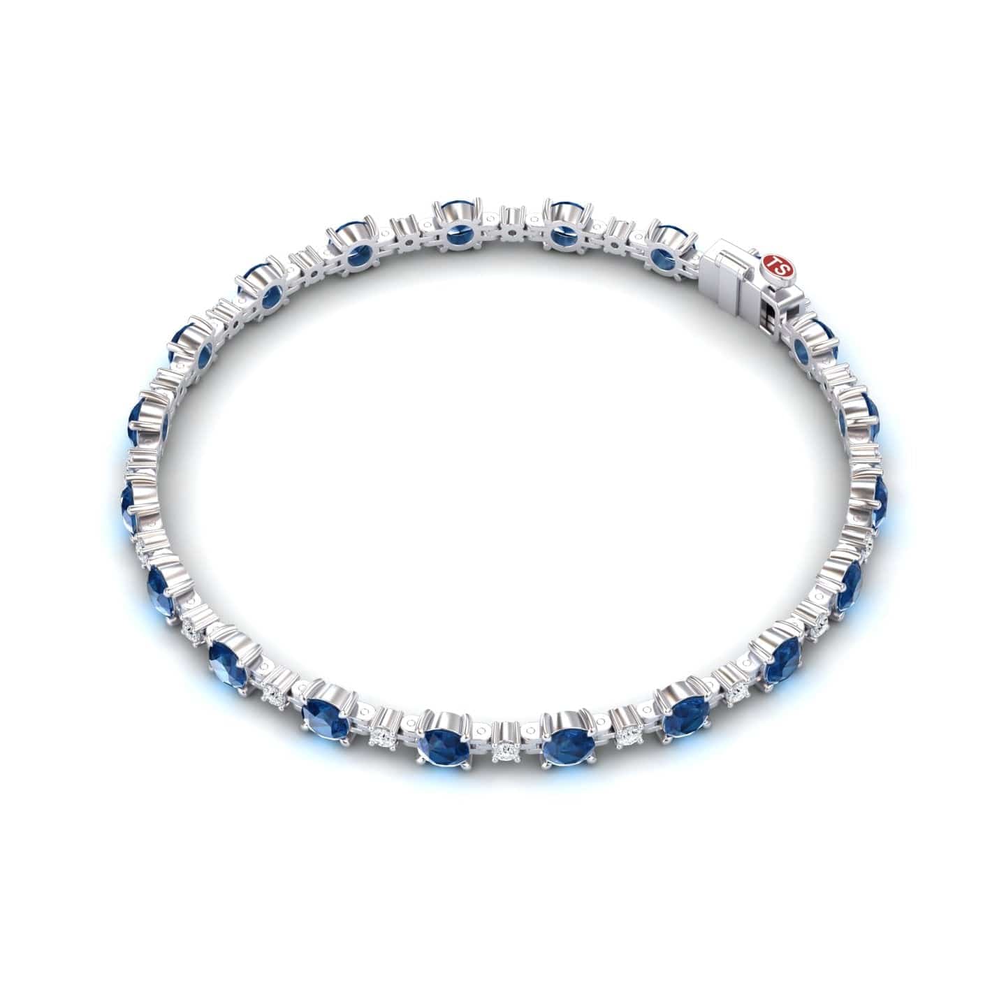 The London Blue Topaz & Diamond Tennis Bracelet - Natalia features evenly spaced round blue topaz gemstones and sparkling diamonds, all set in silver with a secure clasp.