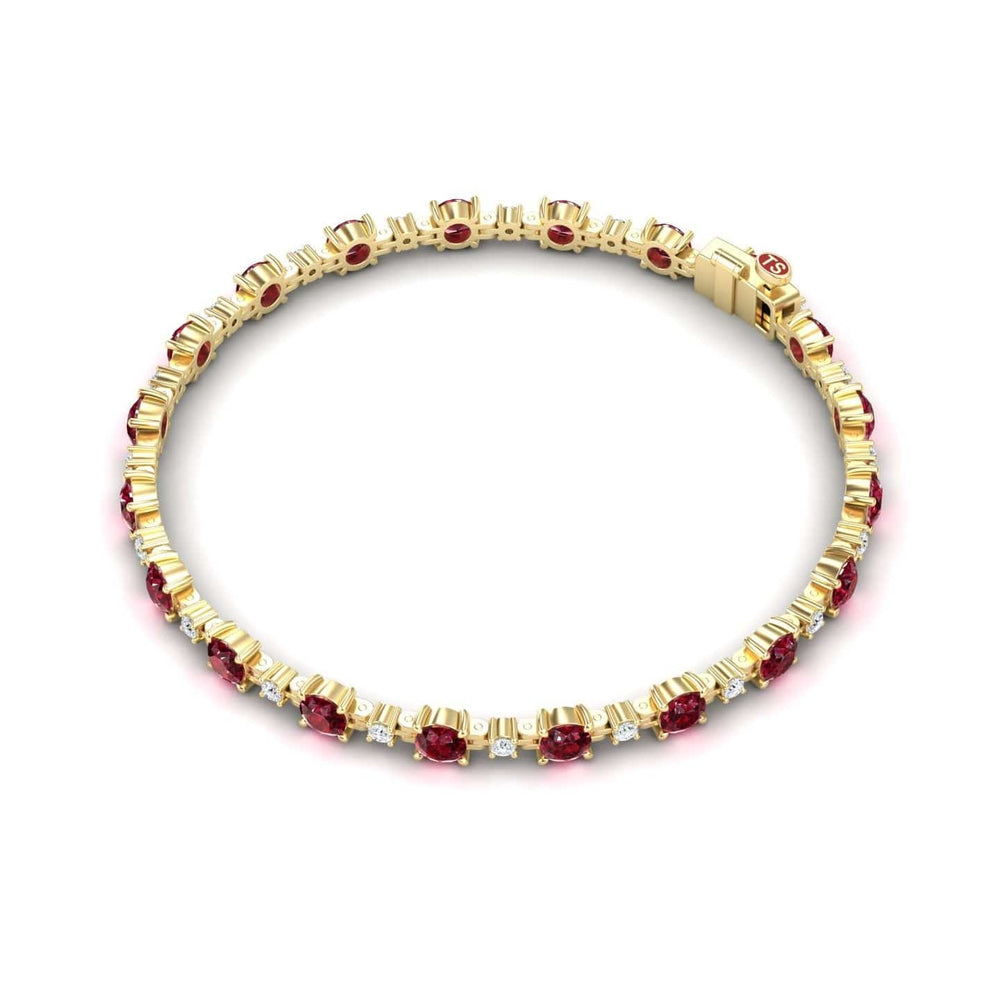 The Ruby & Diamond Tennis Bracelet - Natalia features alternating round rubies and small white diamonds in a symmetrical gold setting, secured with a clasp for an elegant, classic look.