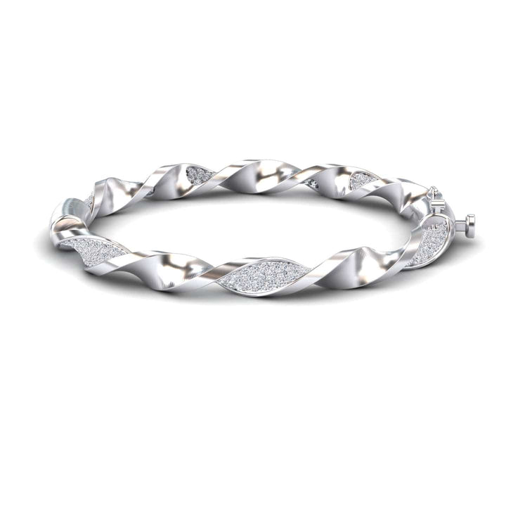 The White Diamond Twisted Bangle Bracelet - Dakota features a modern, elegant twisted design with alternating smooth and textured, glittering sections.