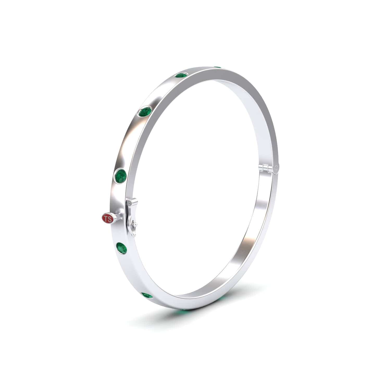 The Emerald Bezel-Set Bracelet - Flavia is a polished silver bangle with evenly spaced green gemstones, a small round red accent, and a clasp closure, shown against a plain white background.
