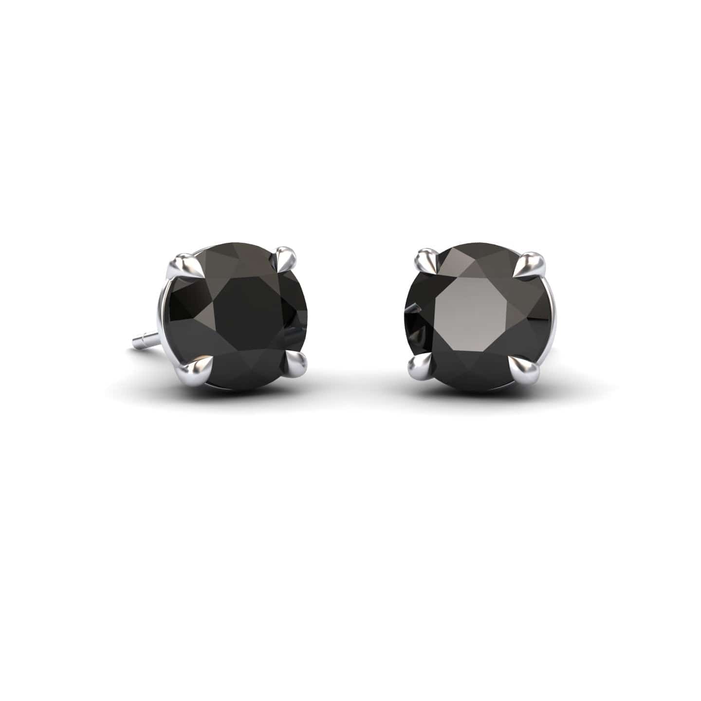 The Black Diamond Stud Earrings - Gauri feature round black gemstones set in sleek silver prongs, shown on a white background.