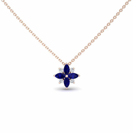 The Blue Sapphire & Diamond Flower Necklace - Keira is a gold chain necklace with a flower pendant featuring four marquise blue sapphires and four small round diamonds arranged alternately.