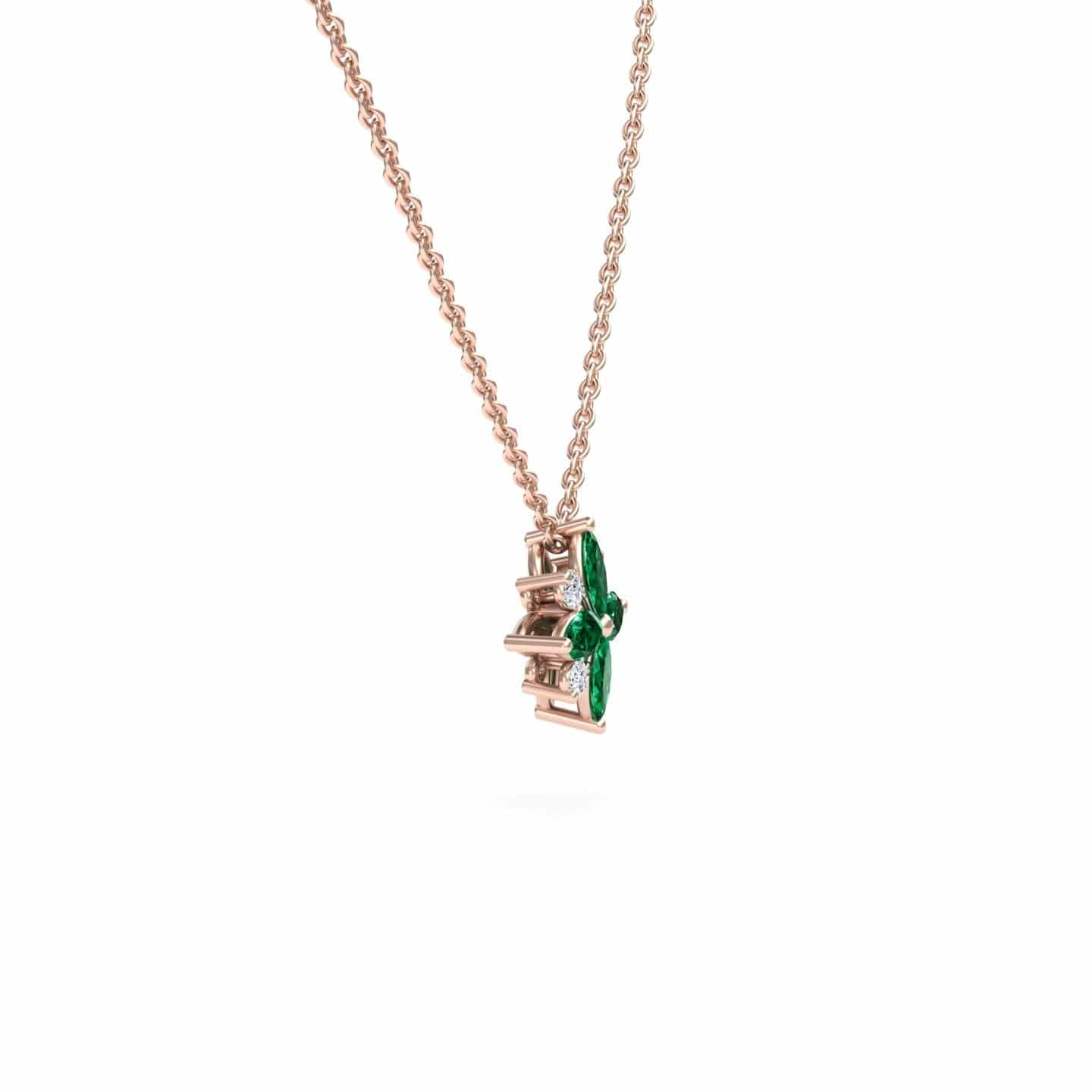 The Emerald & Diamond Flower Necklace - Keira is a rose gold necklace with a vertical pendant showcasing two marquise-cut green gemstones in a modern, geometric design, displayed against a white background.