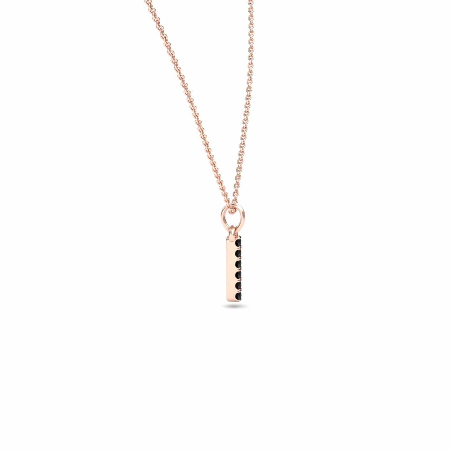 The Black Diamond Vertical Bar Necklace - Lalita is a delicate rose gold necklace with a vertical rectangular pendant featuring a row of small black diamonds on one side, shown against a plain white background.