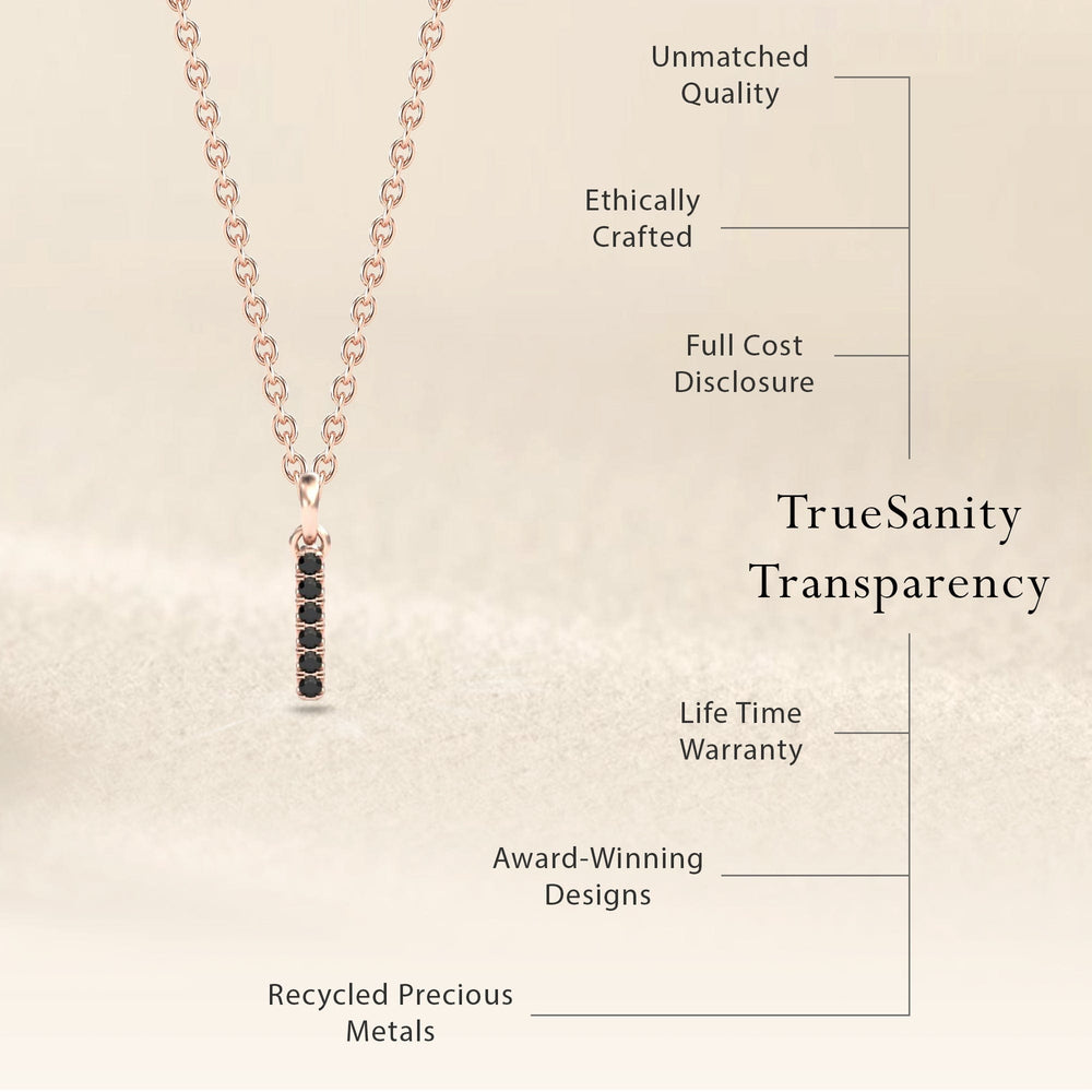 The Black Diamond Vertical Bar Necklace - Lalita features a delicate gold chain with a black diamond bar pendant. Enjoy unmatched quality, ethical crafting, cost transparency, warranty, award-winning design, and recycled precious metals.