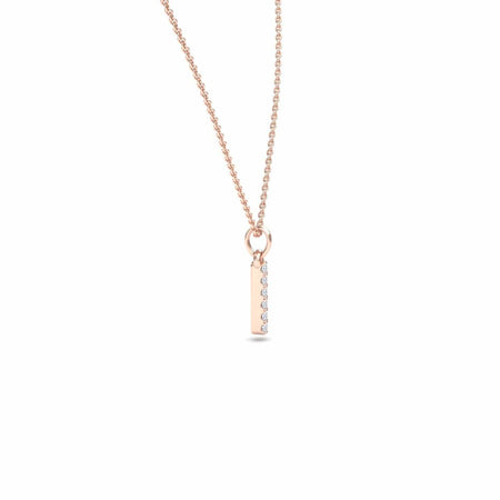 The Lalita White Diamond Vertical Bar Necklace features a delicate rose gold chain and a rectangular pendant adorned with a vertical row of sparkling white diamonds, displayed on a plain white background.