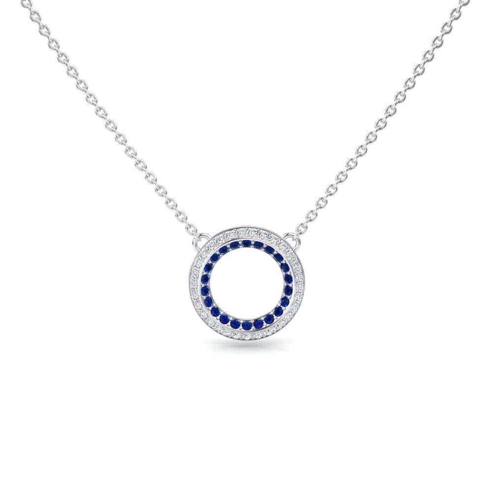 Blue Sapphire & Diamond Double Halo Circle Necklace - Mona: Features a circular pendant with a ring of blue sapphires encircled by diamonds, an open center, and is attached to a delicate chain.