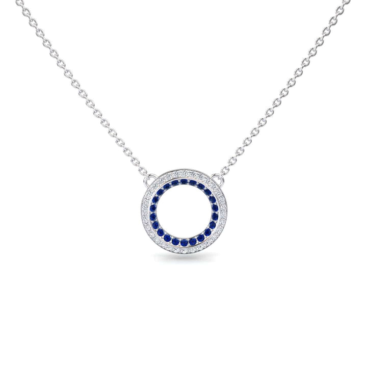 Blue Sapphire & Diamond Double Halo Circle Necklace - Mona: Features a circular pendant with a ring of blue sapphires encircled by diamonds, an open center, and is attached to a delicate chain.