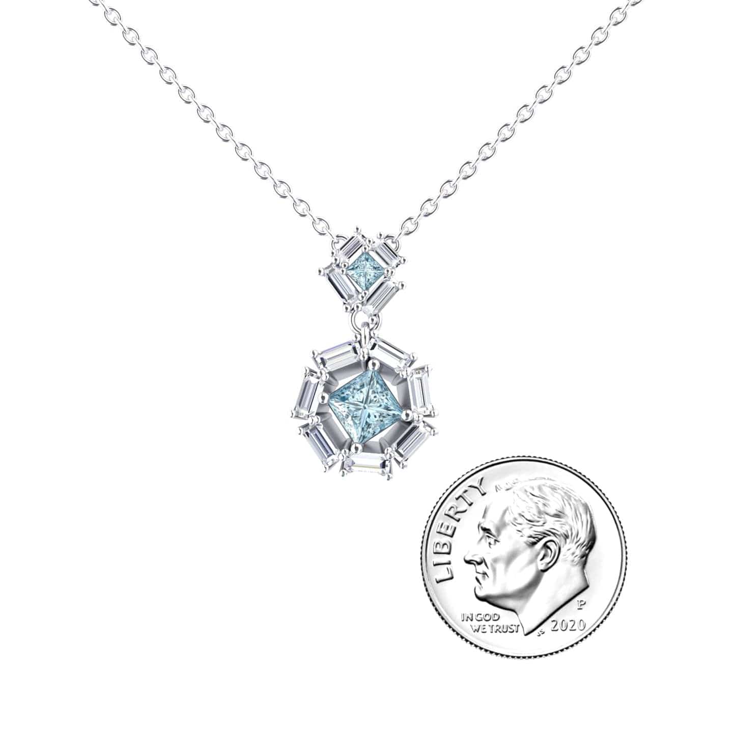 The Reema Aquamarine & Diamond Geometric Halo Necklace features a silver pendant with light blue gemstones, shown beside a 2020 U.S. dime for size comparison.