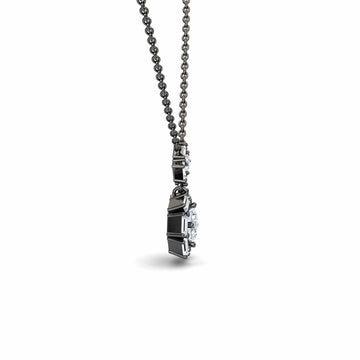 A side view of the White Diamond Geometric Halo Necklace - Reema, showcasing a round white diamond set in a detailed black metal frame, hanging from a matching chain against a white background.