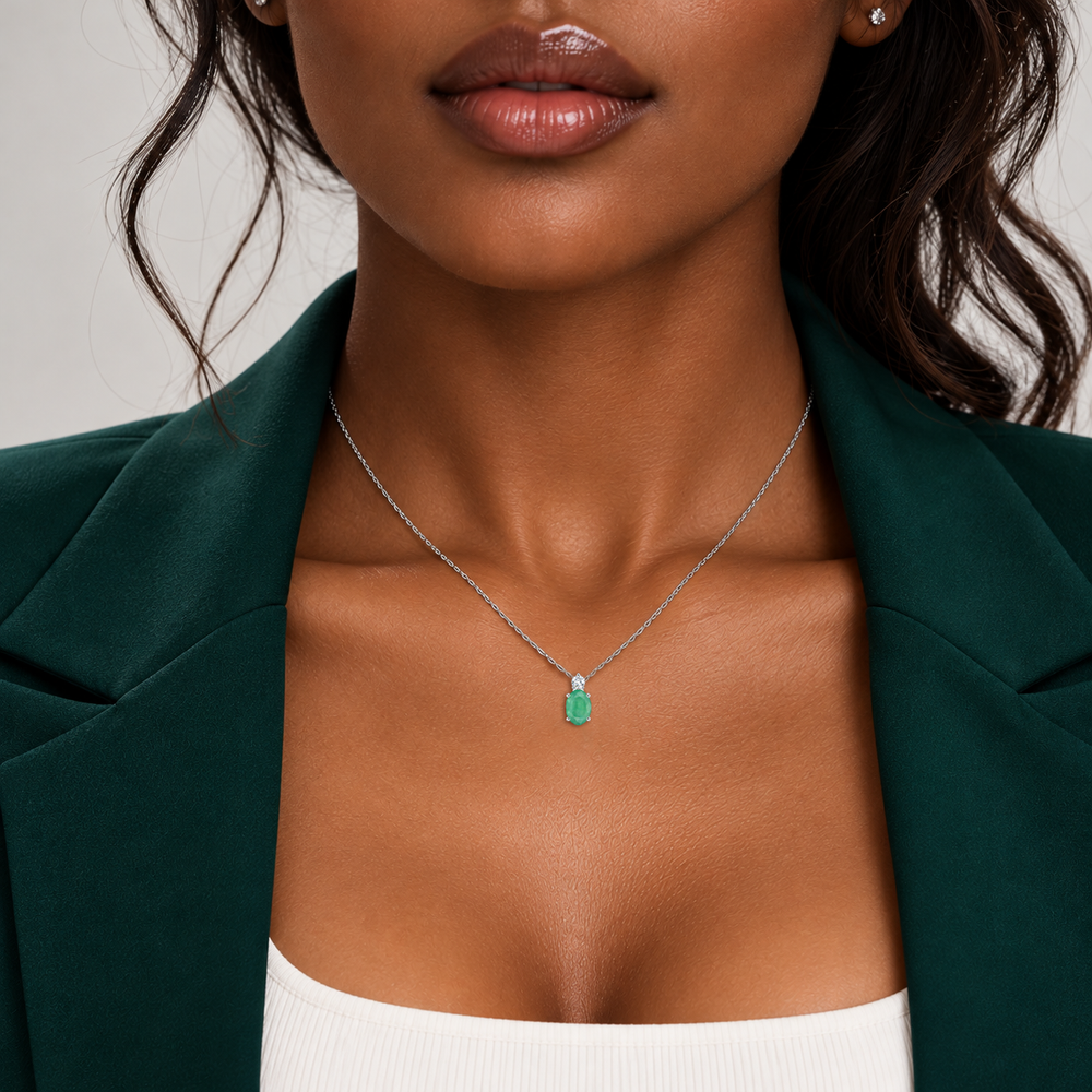 Emerald and diamond oval solitaire necklace in 14k white gold, worn on model, photo 7