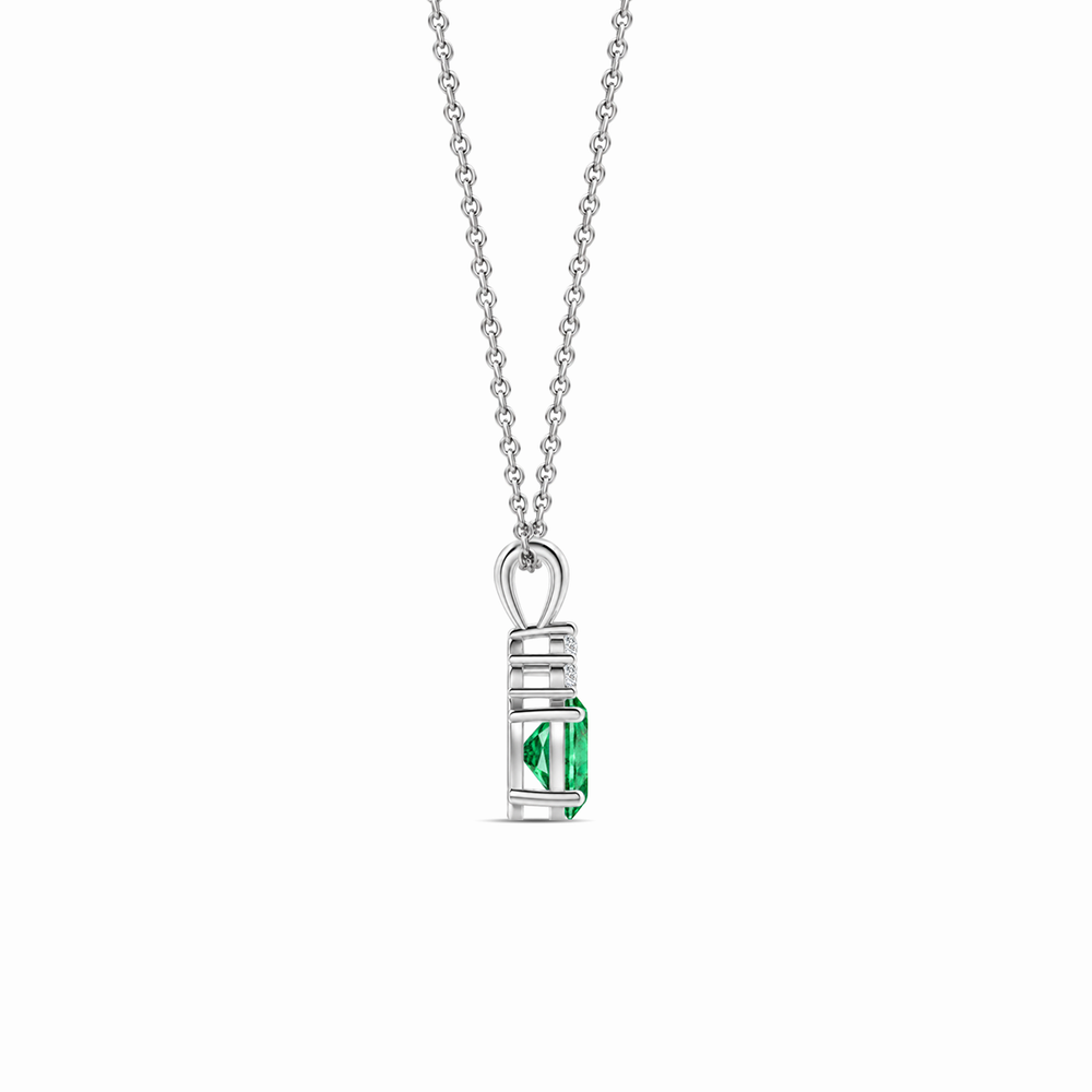 Emerald and trio diamond oval solitaire necklace in 14k white gold, view 2
