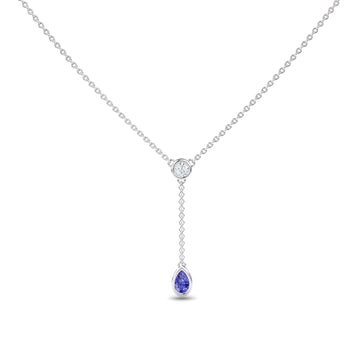 The Tanzanite & Diamond Elegant Drop Necklace - Daniela features a minimalist silver chain with a central round diamond and a short drop ending in a pear-shaped tanzanite gemstone pendant, offering an elegant and refined look.