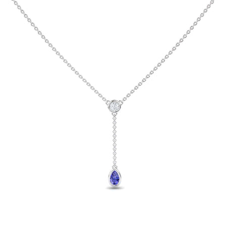 The Tanzanite & Diamond Elegant Drop Necklace - Daniela features a minimalist silver chain with a central round diamond and a short drop ending in a pear-shaped tanzanite gemstone pendant, offering an elegant and refined look.