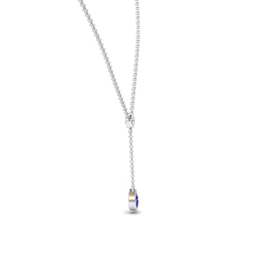 The Tanzanite & Diamond Elegant Drop Necklace - Daniela features a delicate silver chain with a sliding clasp and a vertical drop ending in a small, round tanzanite and diamond pendant. Displayed on a plain white background.