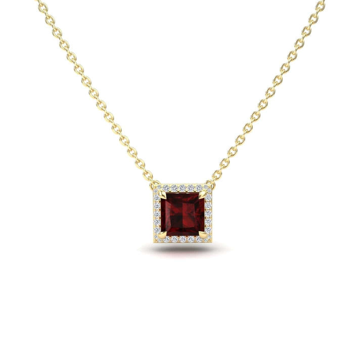 The Garnet & Diamond Halo Necklace - Gabriella features a gold chain with a square-cut deep red garnet pendant framed by diamonds, shown on a white background.