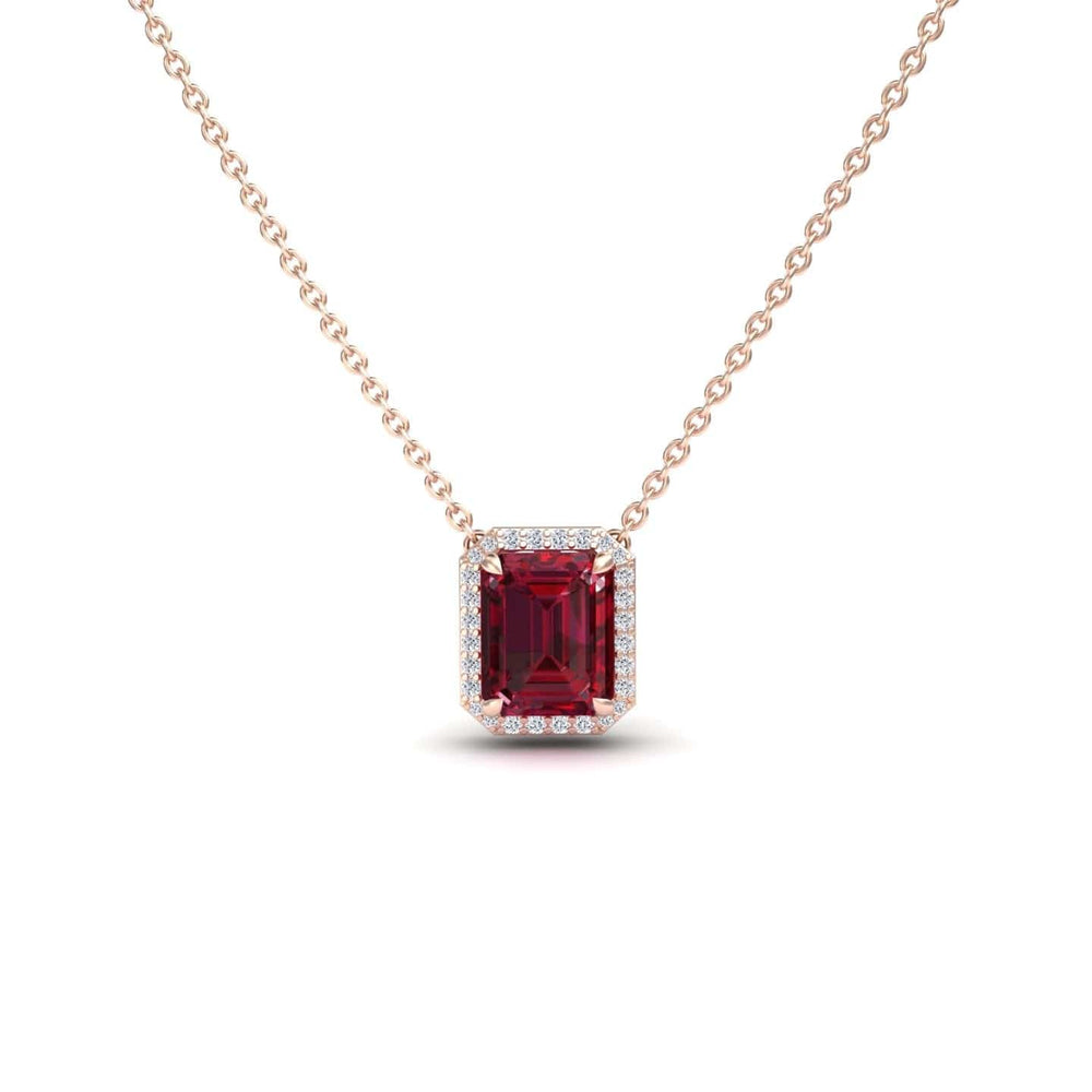 The Ruby & Diamond Halo Necklace - Hilary is a gold chain necklace with a rectangular red gemstone pendant encircled by small white diamonds, shown against a white background.