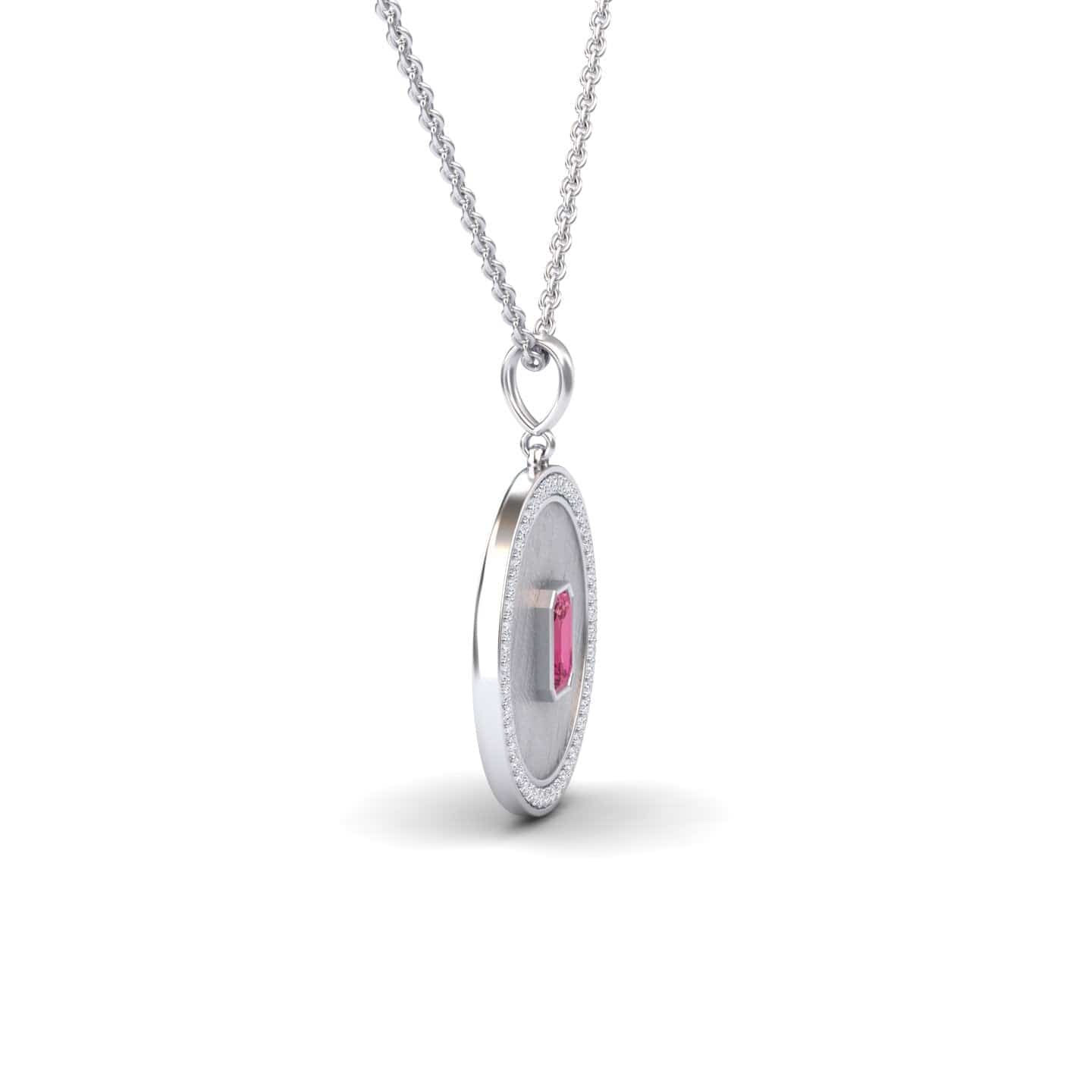 The Jasmine Pink Tourmaline & Diamond Textured Medallion Necklace features a silver chain with a round pendant, showcasing a rectangular pink tourmaline at the center and a delicate textured border.