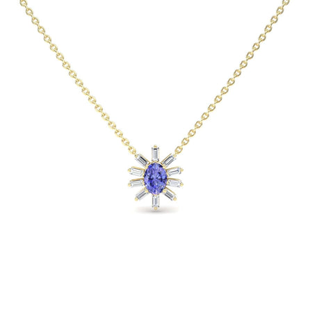 The Tanzanite & Diamond Starburst Necklace - Laura features a gold chain with a central oval blue gemstone and radiating baguette-cut clear stones in a starburst design, displayed against a white background.