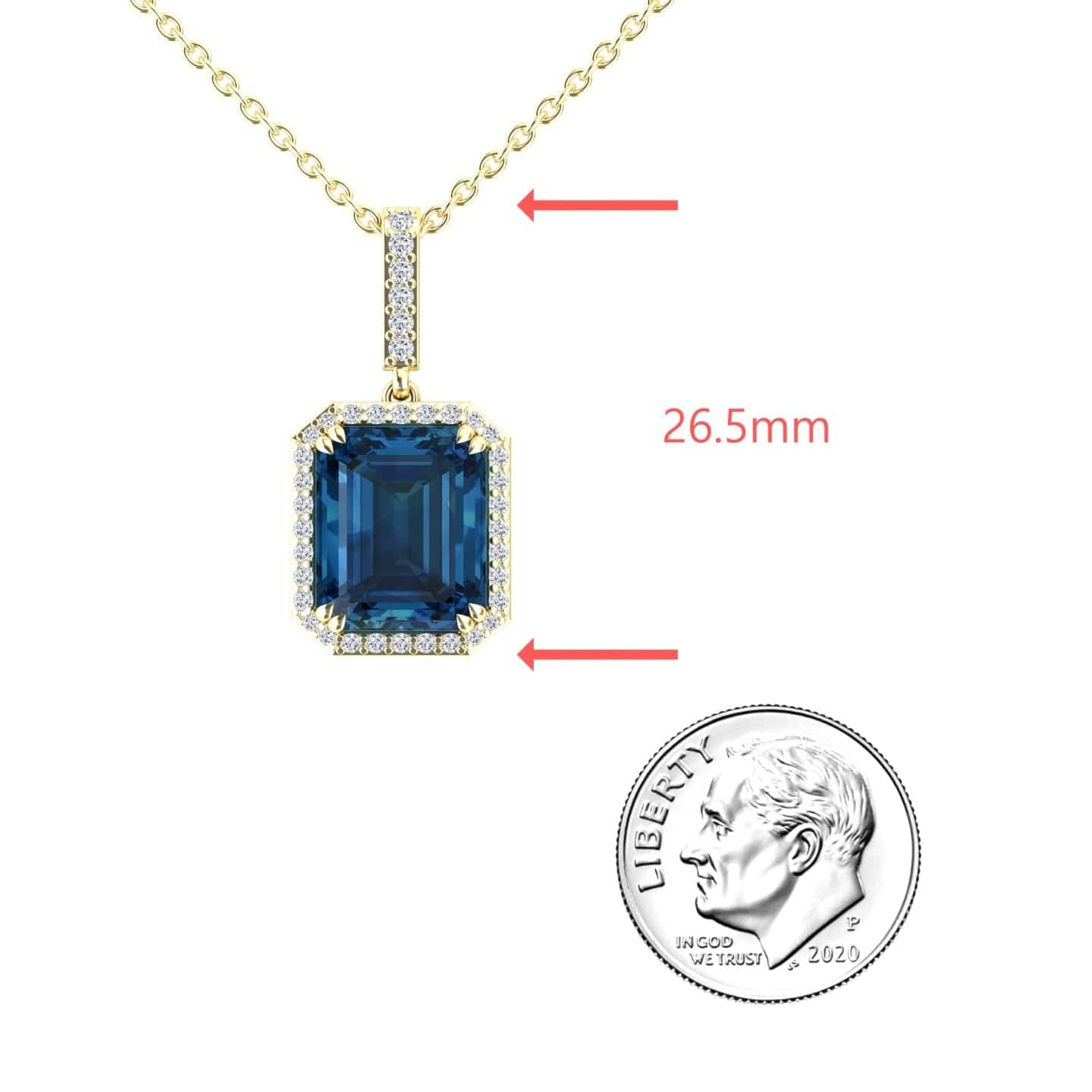 The London Blue Topaz & Diamond Halo Necklace - Sanya features a gold chain with a rectangular blue topaz pendant, haloed by diamonds. Shown next to a US dime for scale, the pendant measures 26.5 mm long.