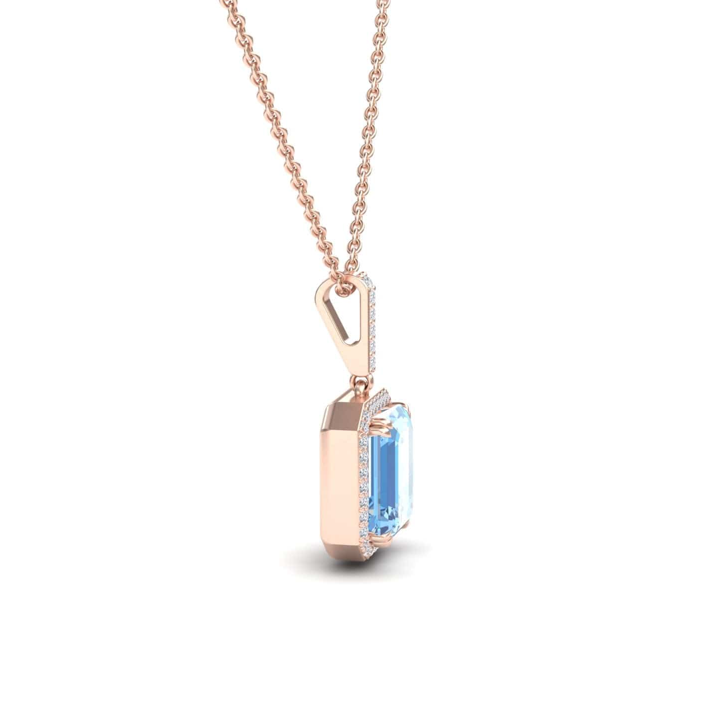 The Sky Blue Topaz & Diamond Halo Necklace - Sanya features a rectangular blue topaz pendant encircled by sparkling diamonds, crafted in rose gold and displayed from the side on a plain white background.