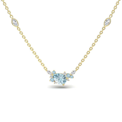 The Aquamarine & Diamond Bouquet Necklace - Daria features a gold chain with a central heart-shaped aquamarine surrounded by diamonds and two marquise-cut gemstone accents on each side.