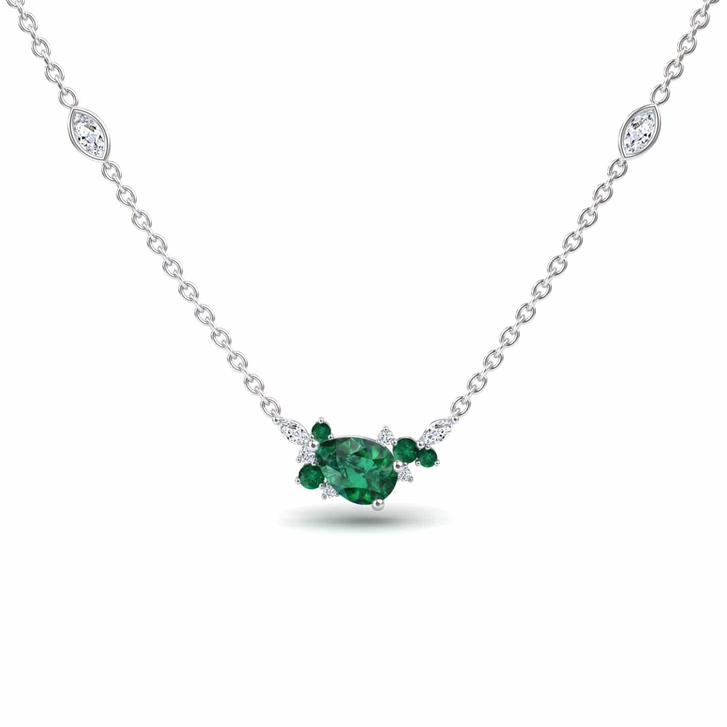 The Emerald & Diamond Bouquet Necklace - Daria is a white gold necklace with a pear-shaped green centerpiece, accented by smaller green and clear gemstones, plus extra clear stones along the chain.