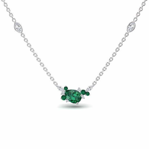 The Emerald & Diamond Bouquet Necklace - Daria is a white gold necklace with a pear-shaped green centerpiece, accented by smaller green and clear gemstones, plus extra clear stones along the chain.