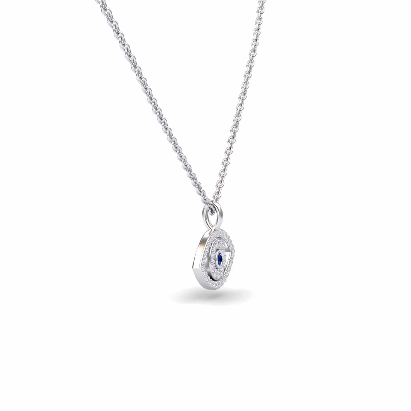 The Blue Sapphire & Diamond Eye Necklace - Elise features a silver chain with a circular pendant, showcasing a blue sapphire center stone encircled by sparkling diamonds, displayed on a plain white background.