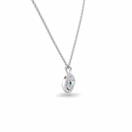 The Emerald & Diamond Eye Necklace - Elise is a silver chain necklace with a round pendant, showcasing a central green gemstone and small clear stones, displayed on a plain white background.