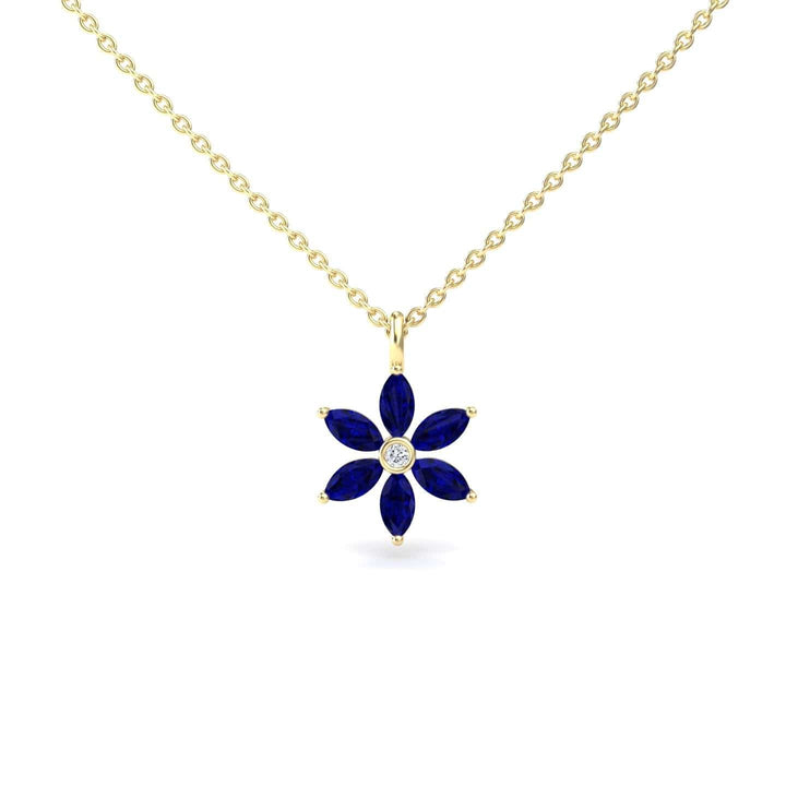 The Lab Grown Blue Sapphire & Diamond Floral Necklace - Erin features a gold chain with a flower-shaped pendant, six blue marquise lab-grown sapphires as petals, and a round lab-grown diamond at the center.