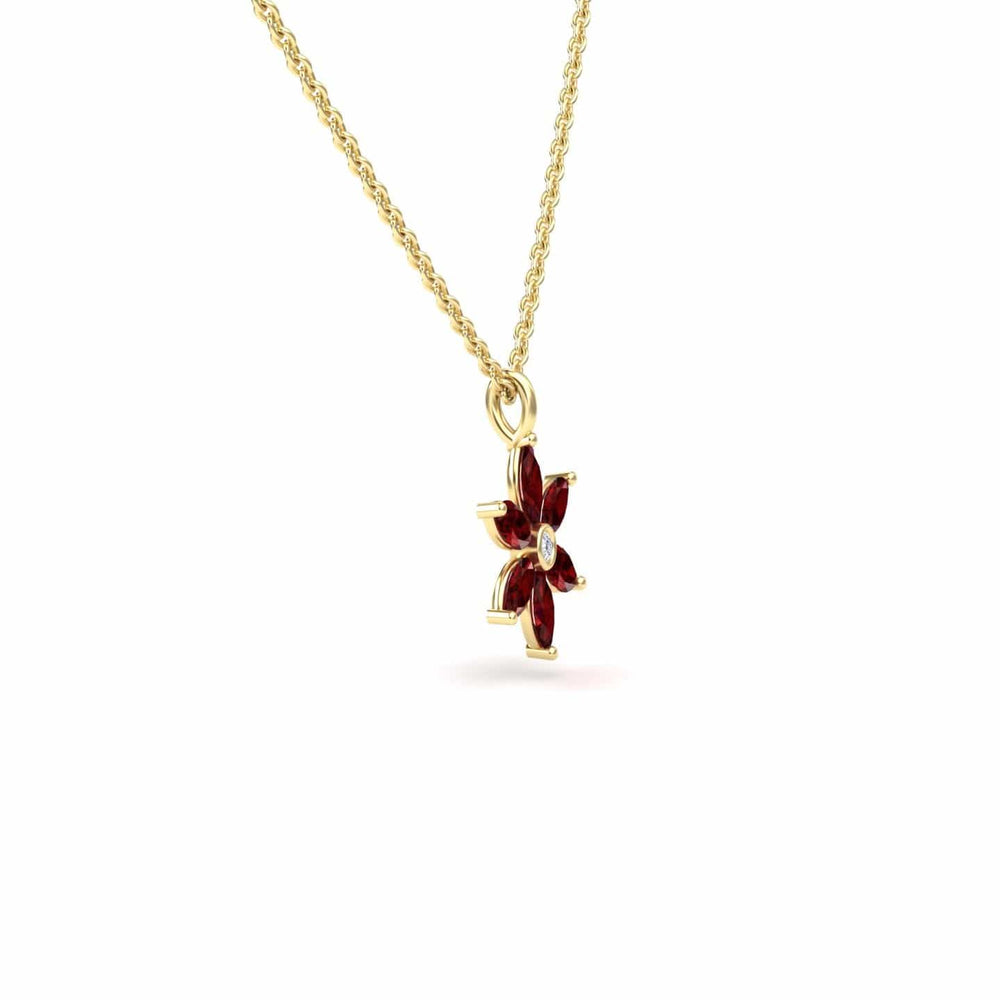 The Lab Grown Ruby & Diamond Floral Necklace - Erin features a gold chain with a flower-shaped pendant, red lab-grown ruby gemstone petals, and a small clear diamond at the center, displayed against a white background.