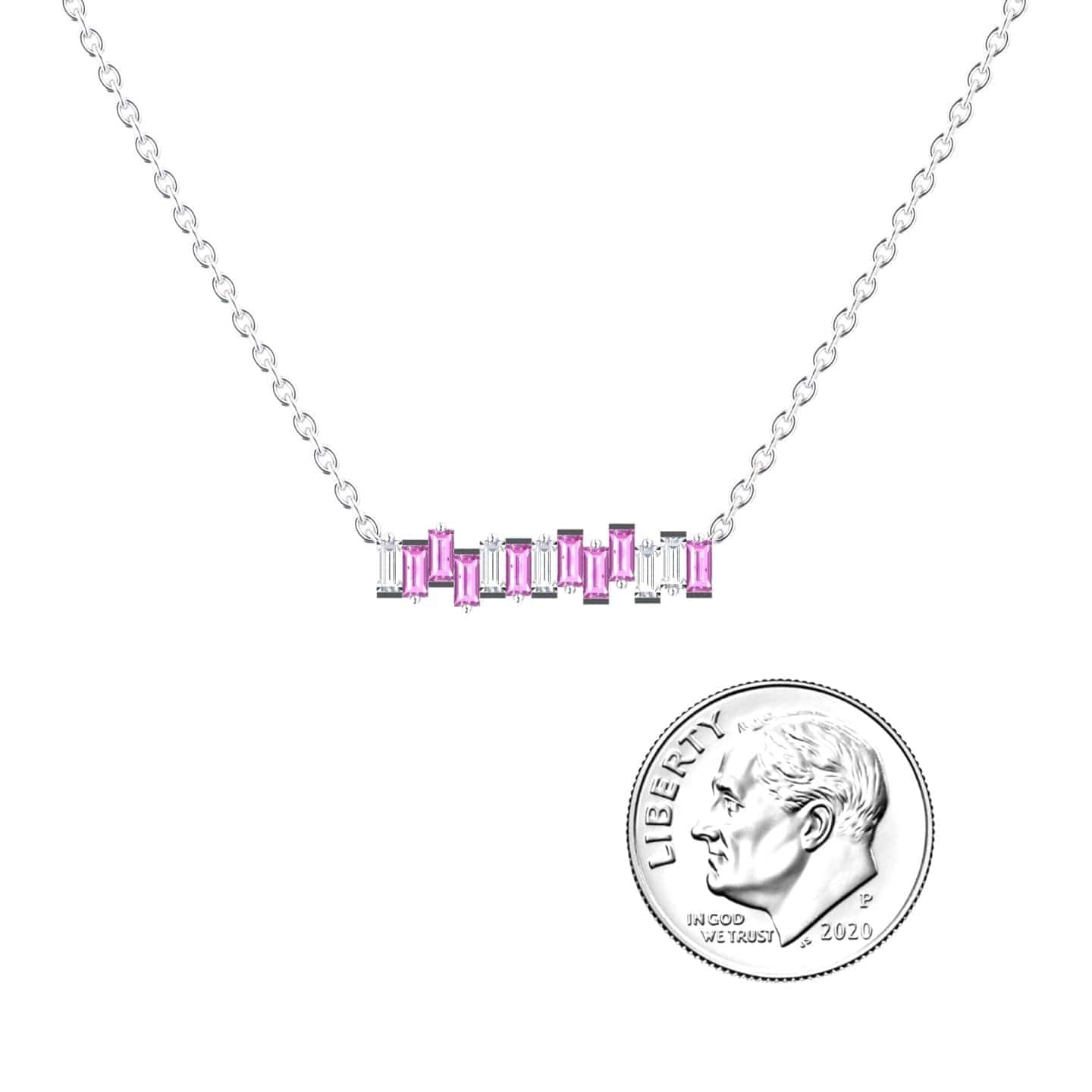The Lab Grown Pink Sapphire & Diamond Geometric Bar Necklace - Fernanda features a silver horizontal bar with alternating pink and clear rectangular stones, shown beside a 2020 U.S. dime for scale.