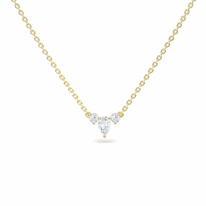 The White Diamond Three-Stone Necklace - Jina features a delicate gold chain with a central pendant of three clustered round diamonds in a subtle triangular shape.