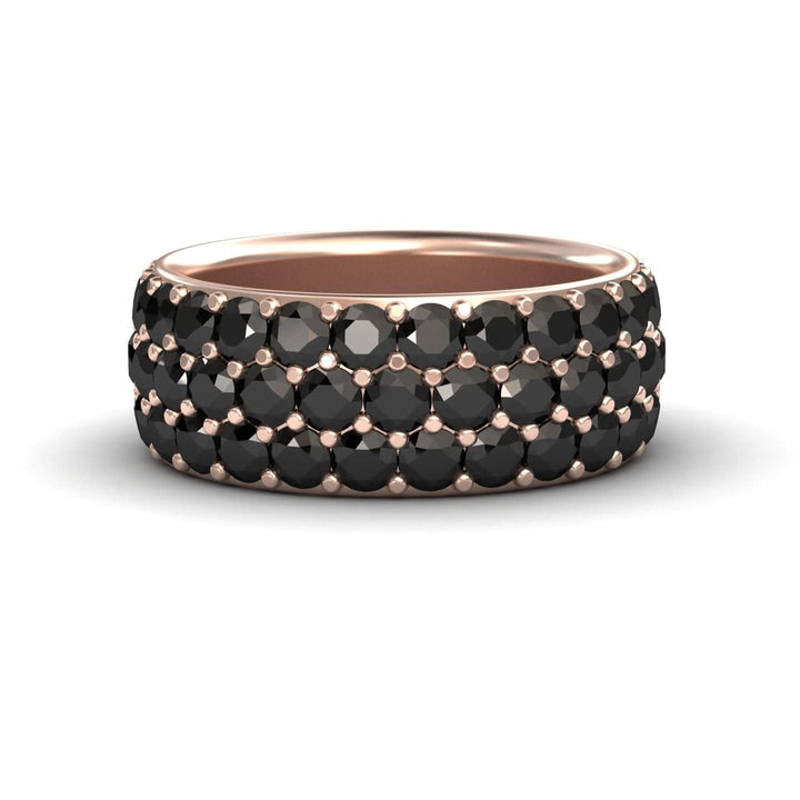 The Leila Black Diamond Three Row Pave Set Wedding Band showcases three rows of round black diamonds in a wide rose gold band, offering a bold and elegant look with a smooth, polished inner surface.