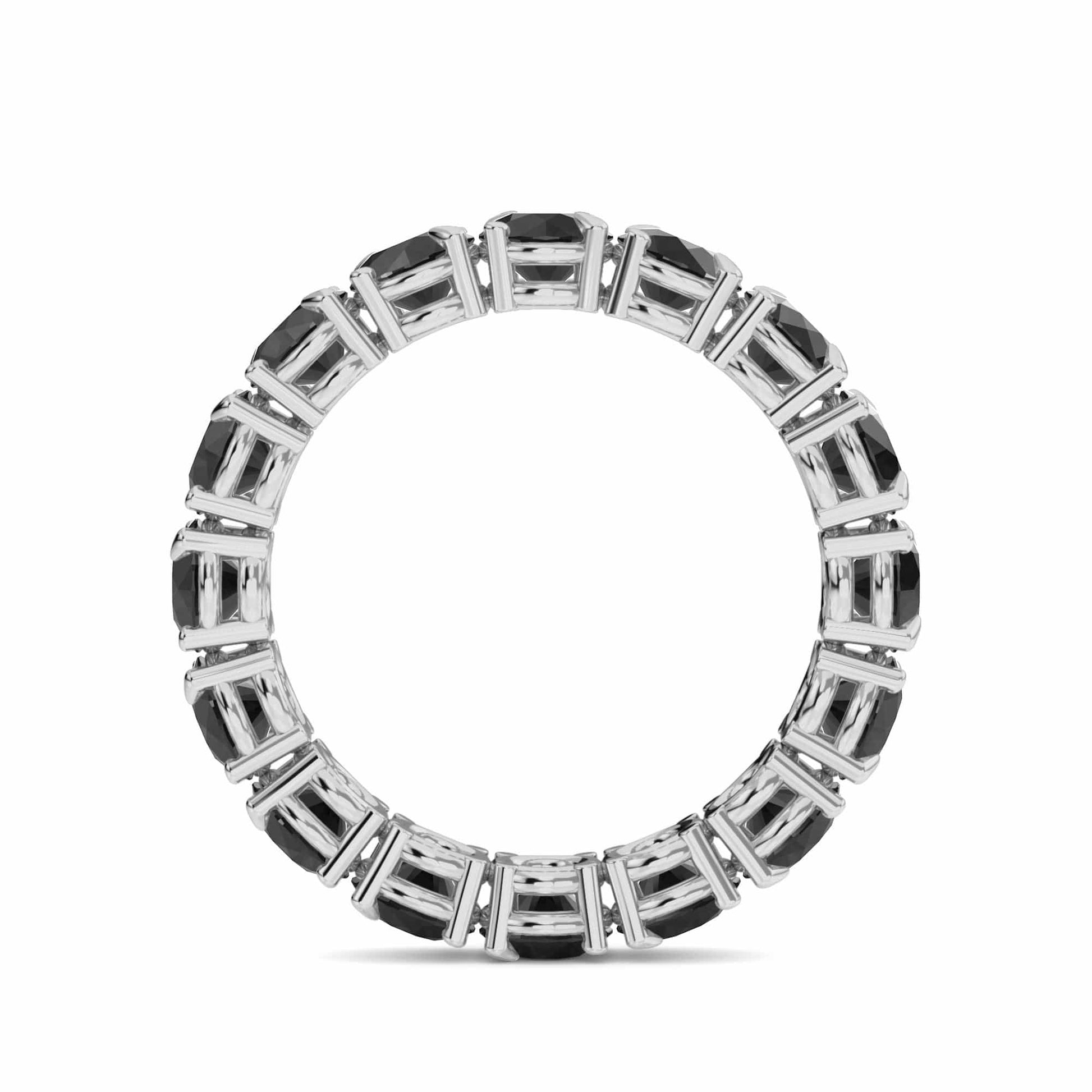 The Black Diamond Prong Set Eternity Band - Mehak is a silver ring featuring rectangular black gemstones set in a continuous circle, displayed on a white background.