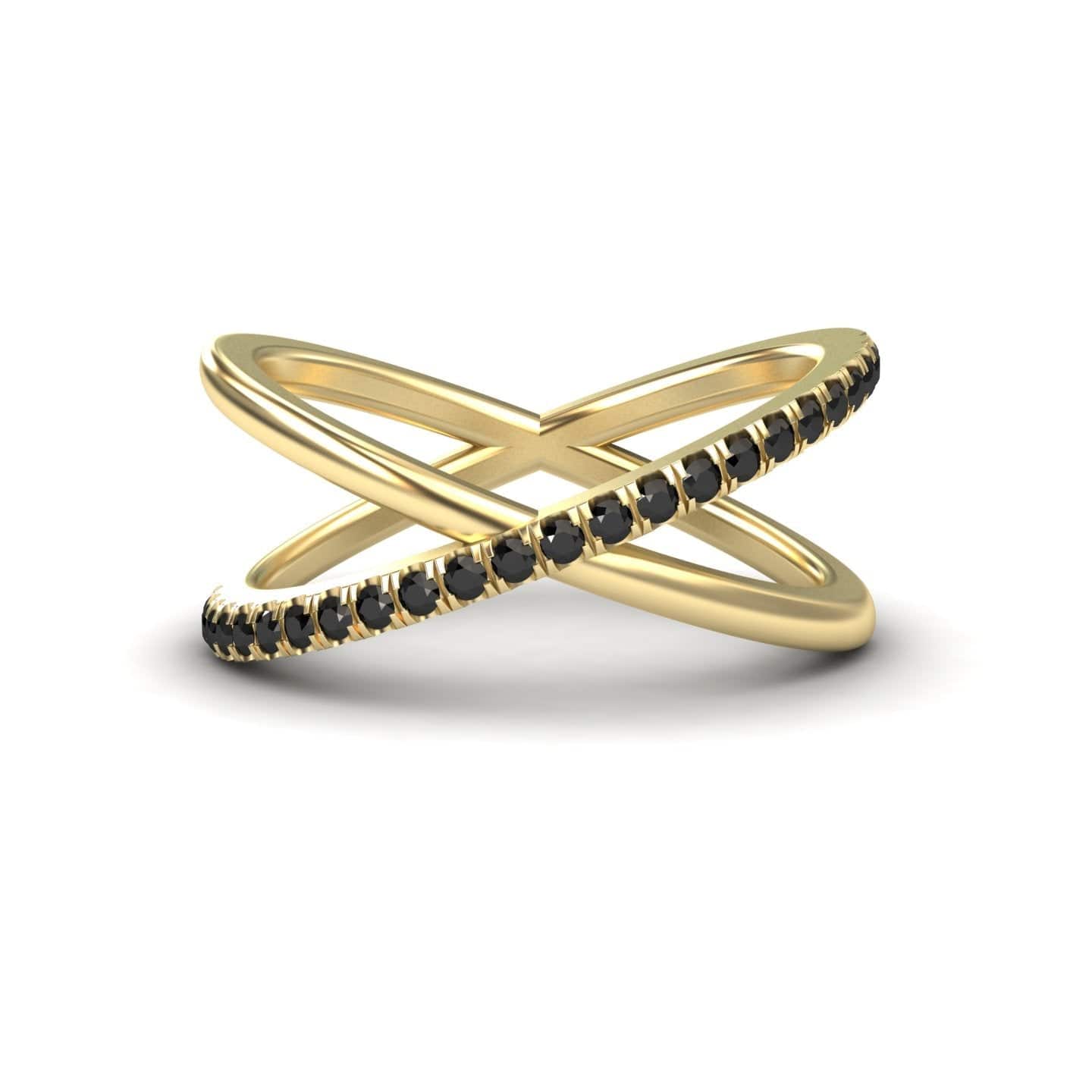 The Black Diamond Criss-Cross Pave Band Ring - Trisha features a gold, X-shaped open design with one band adorned with black diamonds and the other left smooth.
