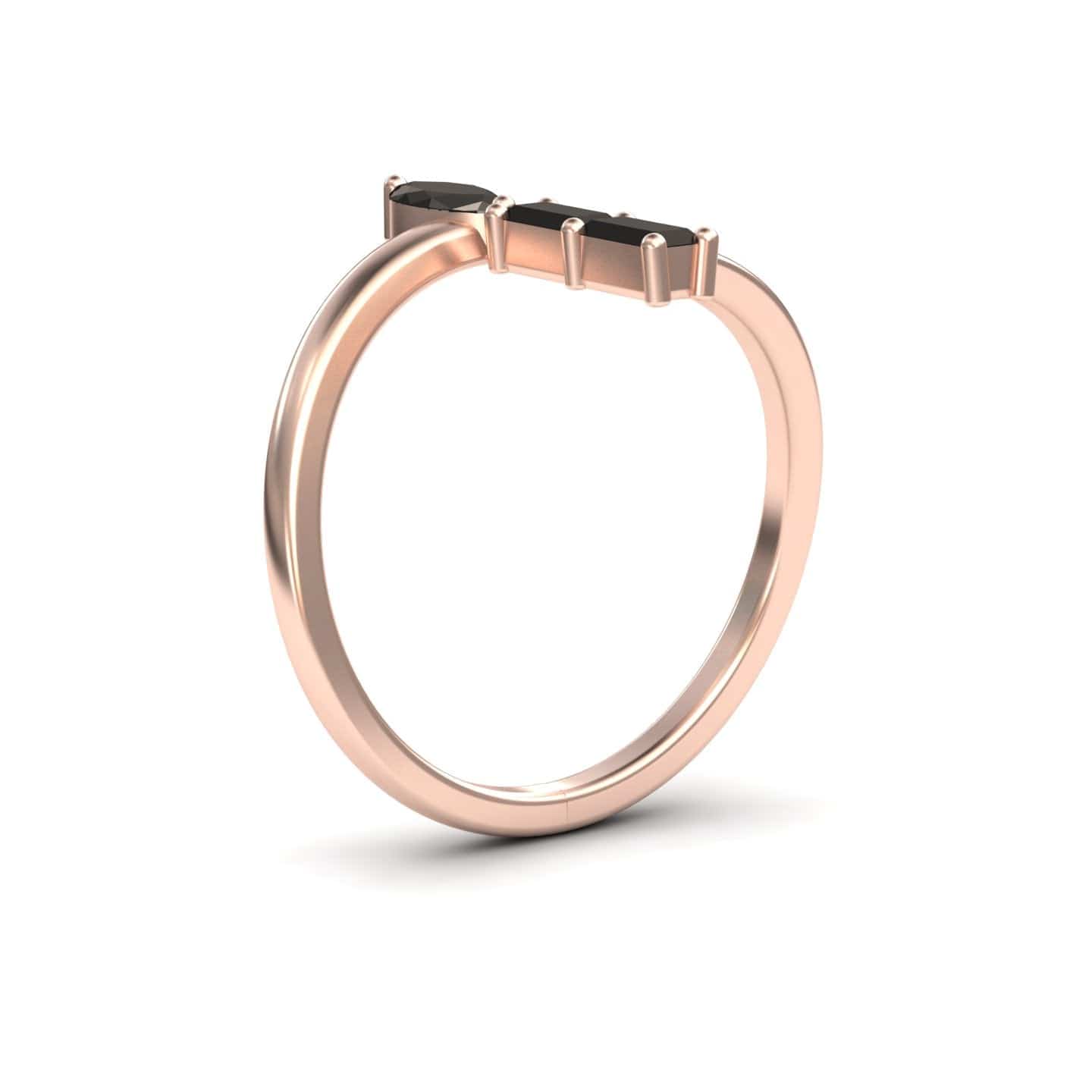 The Statement Shimmer ring (MYSR18) showcases a thin rose gold band with a black rectangular gemstone in a minimalist prong setting, highlighting the black diamonds mesmerizing magic against a white background.